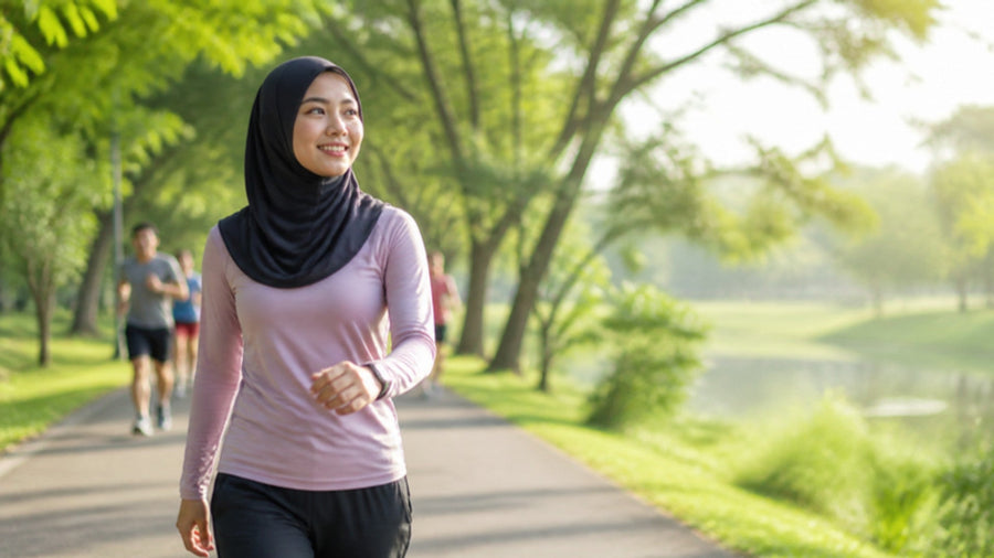 Woman brisk-walking in a Malaysian park as a daily habit to lose belly fat
